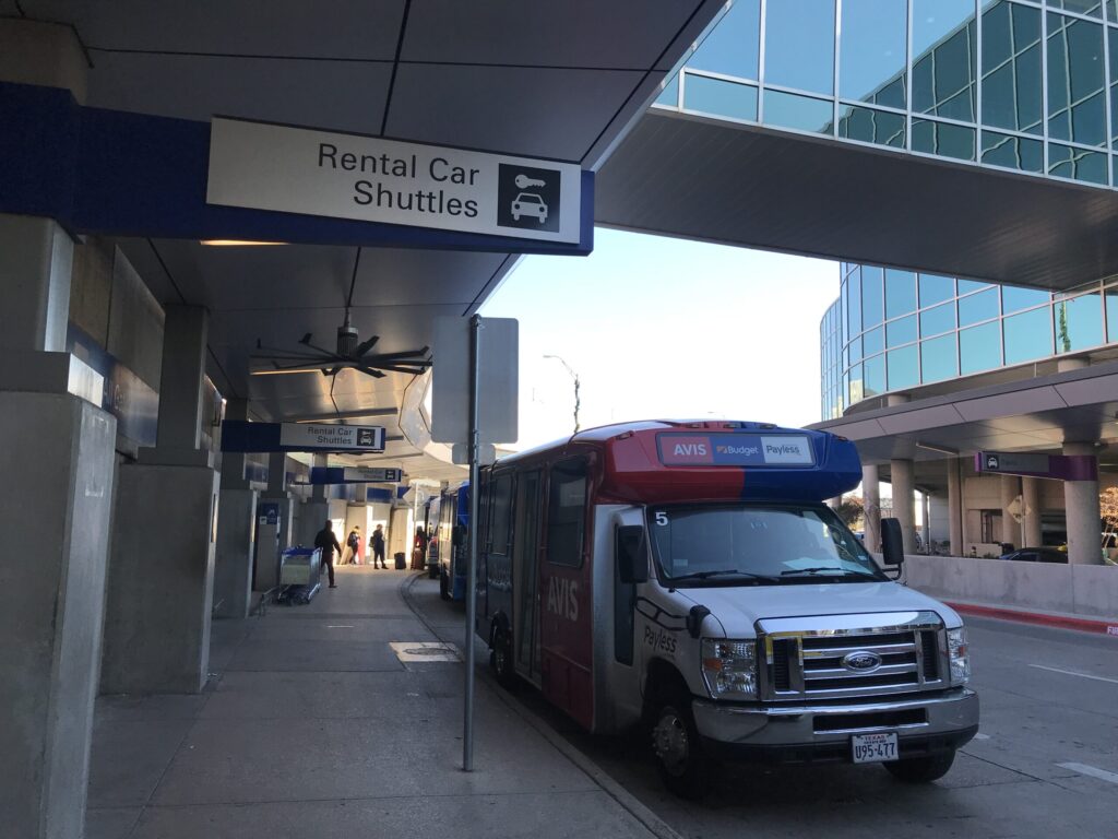 Dallas Love Field airport DAL sign to free shuttle bus to car rental center