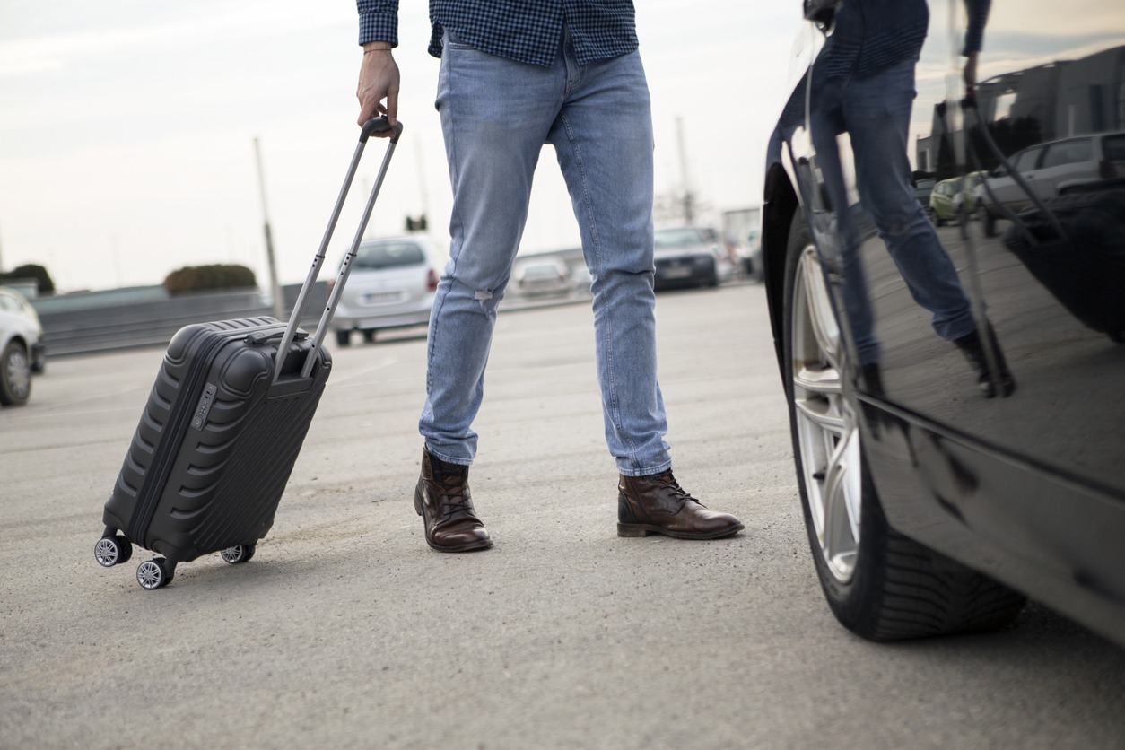 man with suitcase getting ready for trip