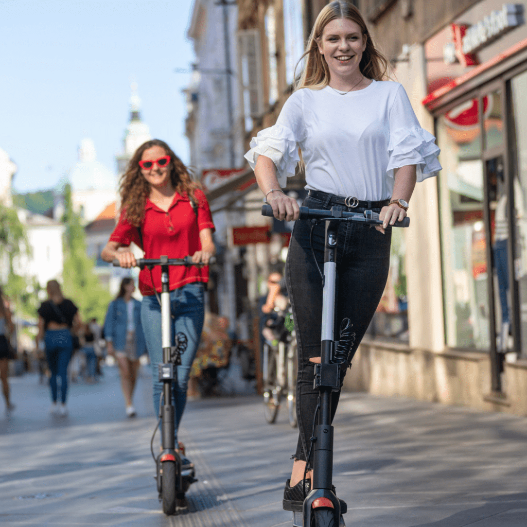 people on scooters enjoying outdoor activities after renting a car for labor day weekend