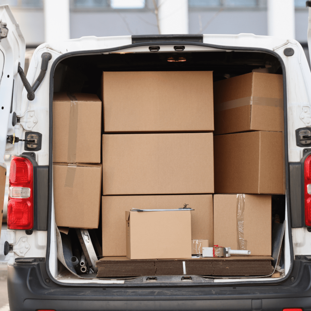 a moving van with boxes loaded in the back