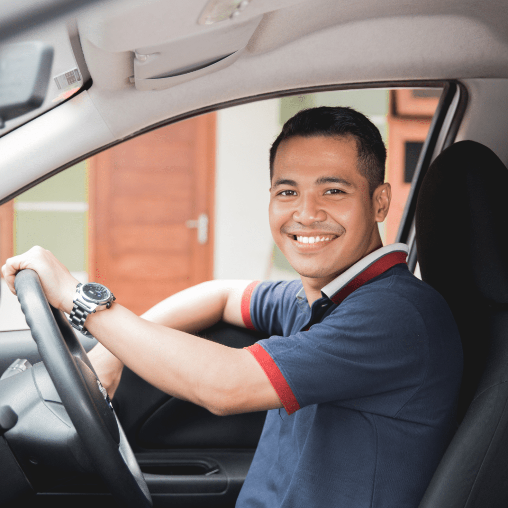 a young man under 25 driving a car