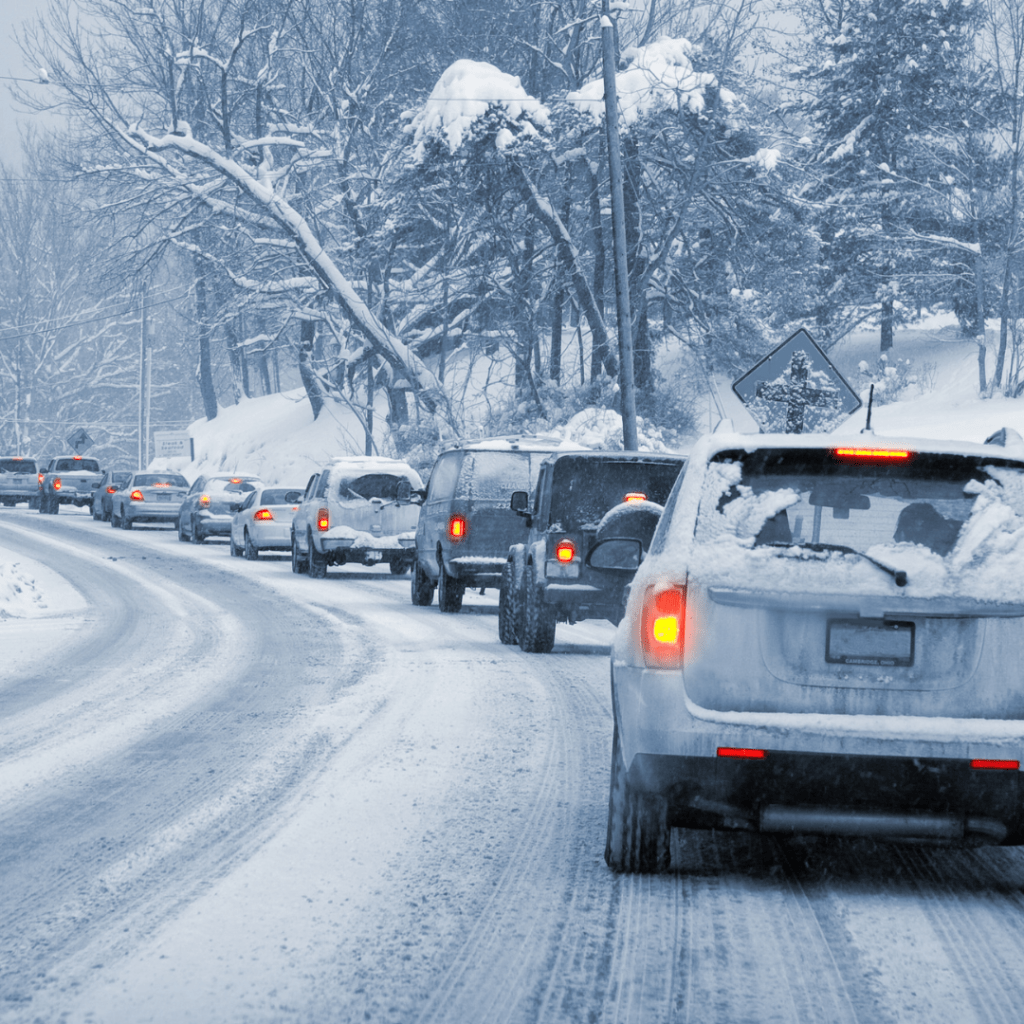 cars stuck in traffic in snow and ice representing safe winter driving