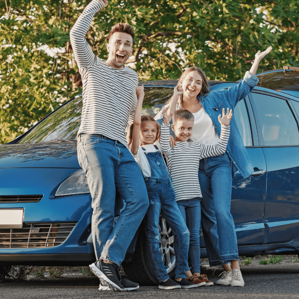 a family cheering outside after finding a rental car near them