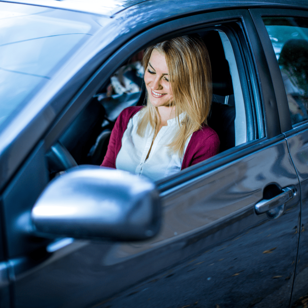 person in a car who found a great rental car near you